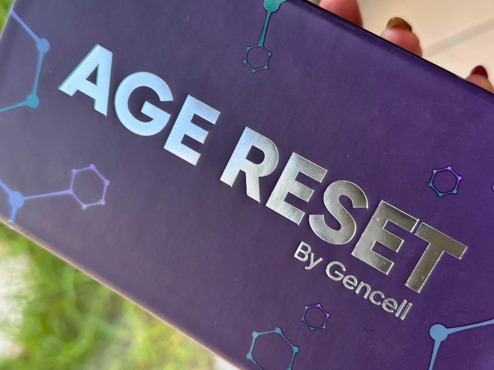Age Reset by Gencell rigid box in purple soft-touch with silver foil lettering
